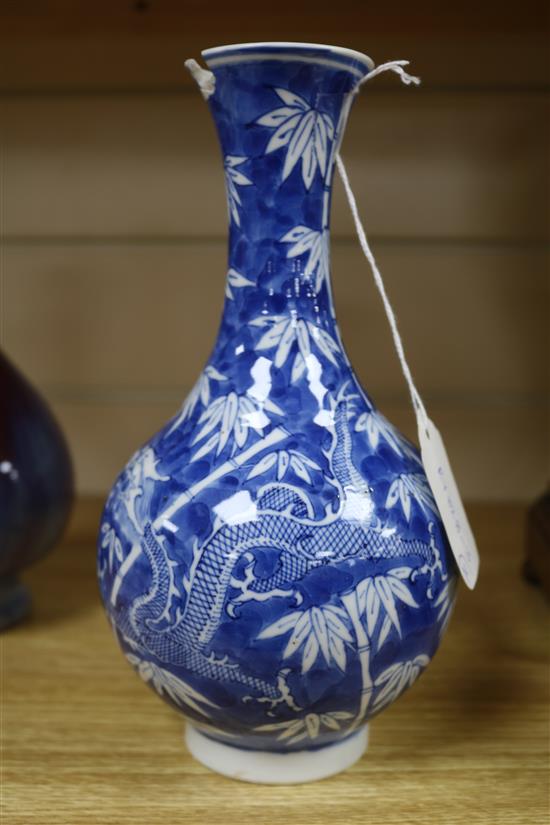 A Chinese blue and white dragon vase and a flambe vase tallest 22.5cm